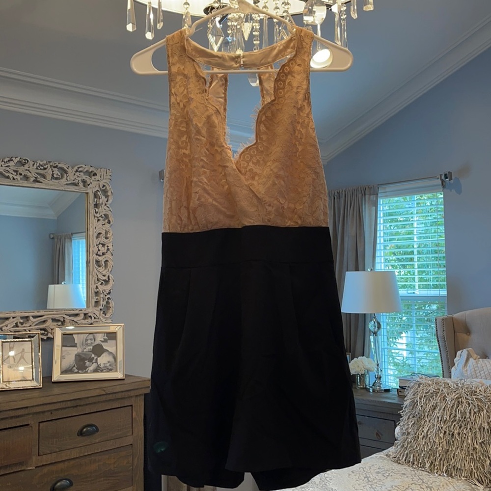 Bebe backless romper with pockets.